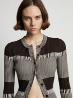 Detail image of model wearing Mini Stripe Cardigan in dark brown/off white