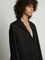 Detail image of model wearing Cotton Linen Blazer in black