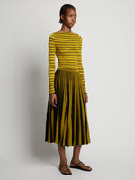 Side image of model wearing Sheer Stripe Sweater in sulphur/black