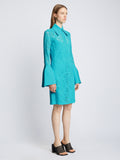 Side image of model wearing Stretch Lace Shirt Dress in cyan