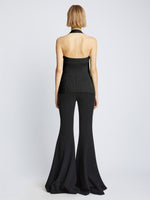 Back image of model wearing Viscose Knit Halter Top in black