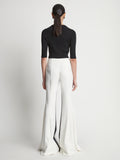 Back image of model wearing Viscose Tuxedo Stripe Pants in off white multi