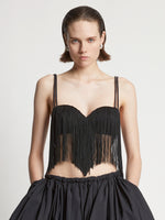 Cropped front image of model wearing Technical Nylon Fringe Bra in black 