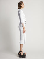 Side image of model wearing Viscose Knit Dress in optic white