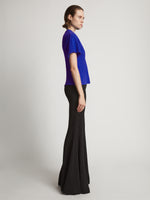 Side image of model wearing Eco Cotton Waisted T-Shirt in cobalt