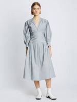 Front image of model wearing Poplin V-Neck Dress in light blue