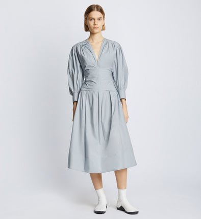 Front image of model wearing Poplin V-Neck Dress in light blue