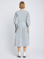 Back image of model wearing Poplin V-Neck Dress in light blue