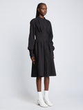 Side full length image of model wearing Eco Poplin Shirt Dress in BLACK