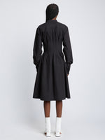 Back full length image of model wearing Eco Poplin Shirt Dress in BLACK