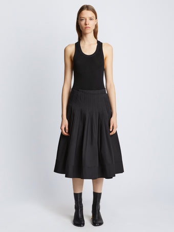 Front image of model in Eco Poplin Wrap Skirt in black