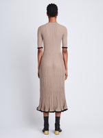 Back full length image of model wearing Silk Cashmere Rib Knit Dress in TAUPE