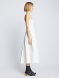 Side full length image of model wearing Eco Poplin Pintuck Dress in WHITE