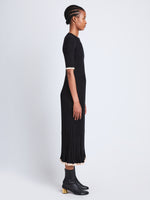 Side full length image of model wearing Silk Cashmere Rib Knit Dress in BLACK