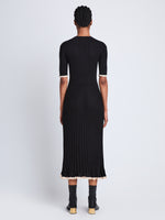 Back full length image of model wearing Silk Cashmere Rib Knit Dress in BLACK