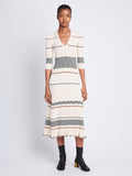 Front full length image of model wearing Wavy Stripe Rib Knit Dress in ECRU MULTI