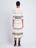 Back full length image of model wearing Wavy Stripe Rib Knit Dress in ECRU MULTI