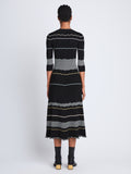 Back full length image of model wearing Wavy Stripe Rib Knit Dress in BLACK MULTI