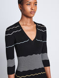 Detail image of model wearing Wavy Stripe Rib Knit Dress in BLACK MULTI