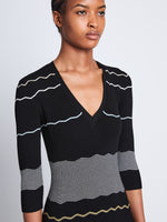 Detail image of model wearing Wavy Stripe Rib Knit Dress in BLACK MULTI