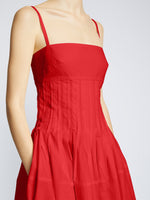 Detail image of model wearing Poplin Pintuck Dress in RED