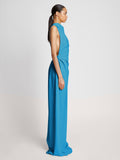 Side image of model wearing Matte Viscose Crepe Backless Dress in turquoise