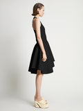 Side image of model wearing Sculpted Knit Dress in black