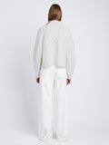 Back full length image of model wearing Relaxed Chunky Cable Zip Sweater in OFF WHITE