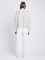 Back full length image of model wearing Relaxed Chunky Cable Zip Sweater in OFF WHITE