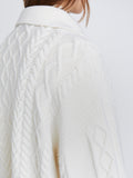 Detail image of model wearing Relaxed Chunky Cable Zip Sweater in OFF WHITE