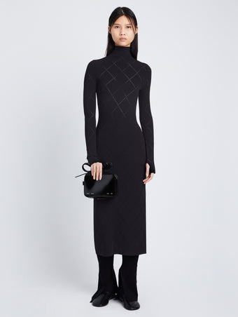 Front full length image of model wearing Pointelle Diamonds Turtleneck Dresses in BLACK