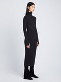 Side full length image of model wearing Pointelle Diamonds Turtleneck Dresses in BLACK