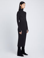 Side full length image of model wearing Pointelle Diamonds Turtleneck Dresses in BLACK