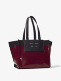 Side image of Large Morris Coated Canvas Tote in BORDEAUX