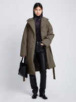 Front full length image of model wearing Technical Suiting Wrap Coat in WOOD untied