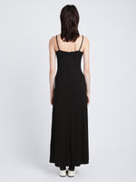 Side full length image of model wearing Matte Crepe Spaghetti Dress in BLACK