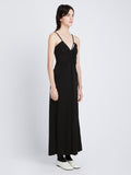 Back full length image of model wearing Matte Crepe Spaghetti Dress in BLACK