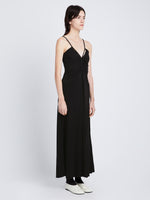 Back full length image of model wearing Matte Crepe Spaghetti Dress in BLACK