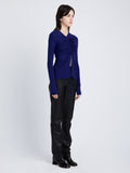 Side full length image of model wearing Matte Crepe Long Sleeve Top in BLUEBERRY