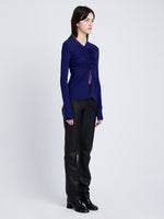 Side full length image of model wearing Matte Crepe Long Sleeve Top in BLUEBERRY