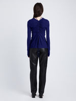 Back full length image of model wearing Matte Crepe Long Sleeve Top in BLUEBERRY