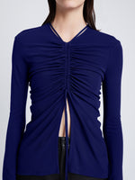 Detail image of model wearing Matte Crepe Long Sleeve Top in BLUEBERRY