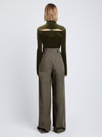 Back full length image of model wearing Stretch Velvet Turtleneck Top in MILITARY buttoned