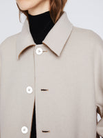 Detail image of model wearing Reversible Double Face Coat in CAMEL / OFF WHITE on OFF WHITE side