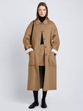 Front full length image of model wearing Reversible Double Face Coat in CAMEL / OFF WHITE on CAMEL side