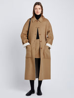 Front full length image of model wearing Reversible Double Face Coat in CAMEL / OFF WHITE on CAMEL side