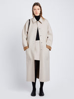 Front full length image of model wearing Reversible Double Face Coat in CAMEL / OFF WHITE on OFF WHITE side