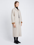 Side full length image of model wearing Reversible Double Face Coat in CAMEL / OFF WHITE on OFF WHITE SIDE