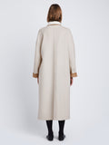 Back full length image of model wearing Reversible Double Face Coat in CAMEL / OFF WHITE on OFF WHITE side