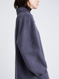 Detail image of model wearing Reversible Double Face Coat in BLACK / STEEL GREY on STEEL GREY side